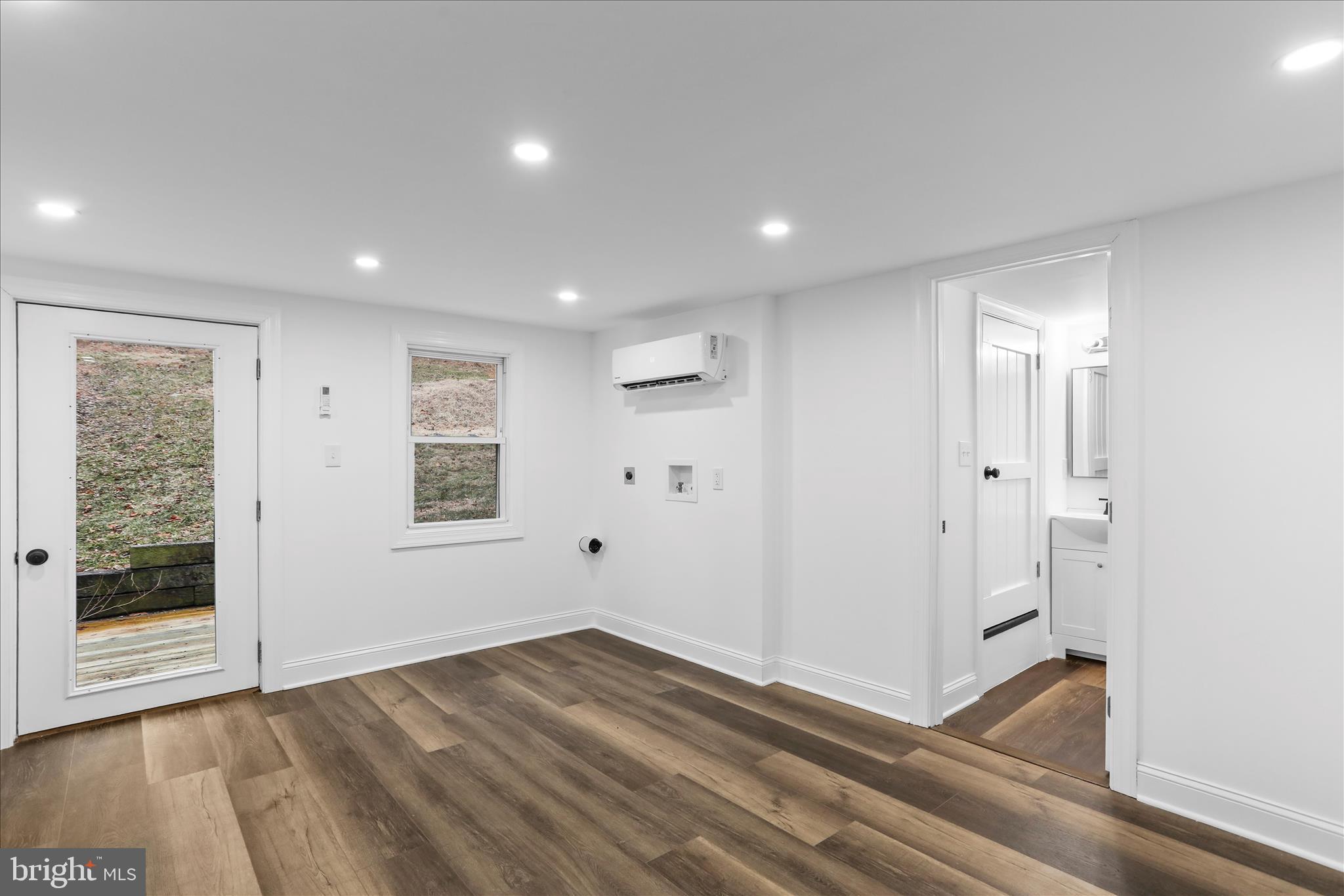 6906 Mariah Furnace Road Boonsboro, MD 21713 - Photo 13 of 38 an empty room with wooden floor and windows