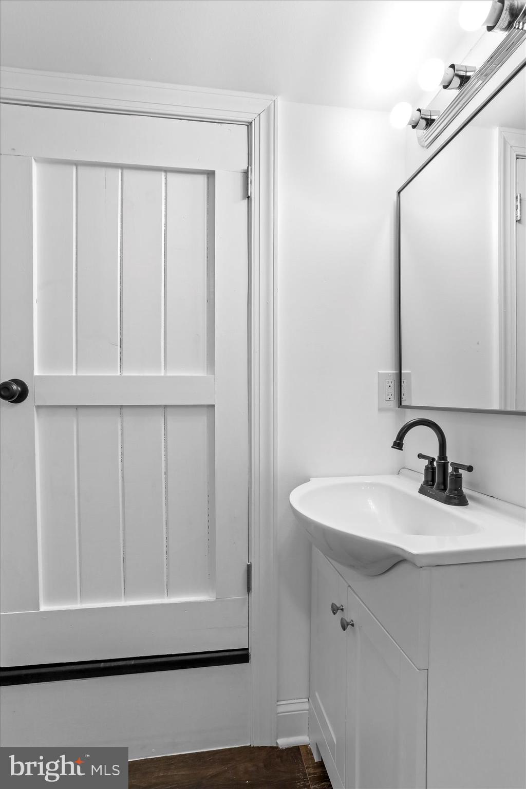 6906 Mariah Furnace Road Boonsboro, MD 21713 - Photo 20 of 38 a bathroom with a sink a mirror and a window