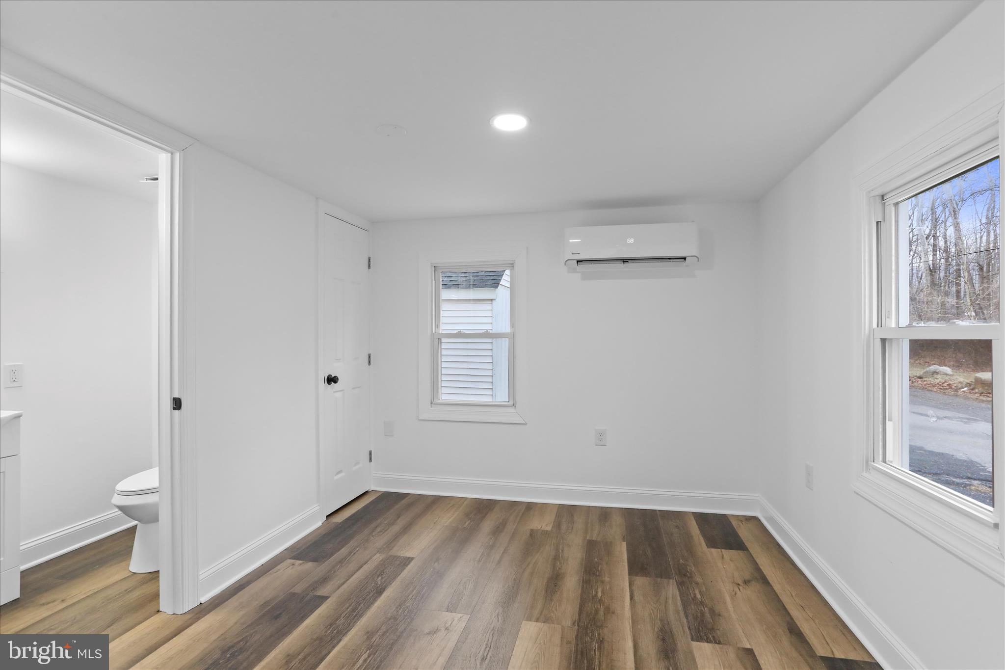 6906 Mariah Furnace Road Boonsboro, MD 21713 - Photo 9 of 38 wooden floor in an empty room with a window