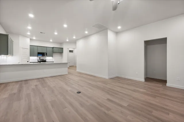 a view of kitchen with wooden floor and window