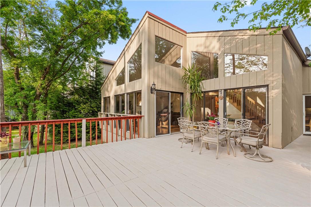 54 Talcott Road Rye Brook, NY 10573 - Photo 1 of 1 a view of a patio with couches table and chairs and wooden floor