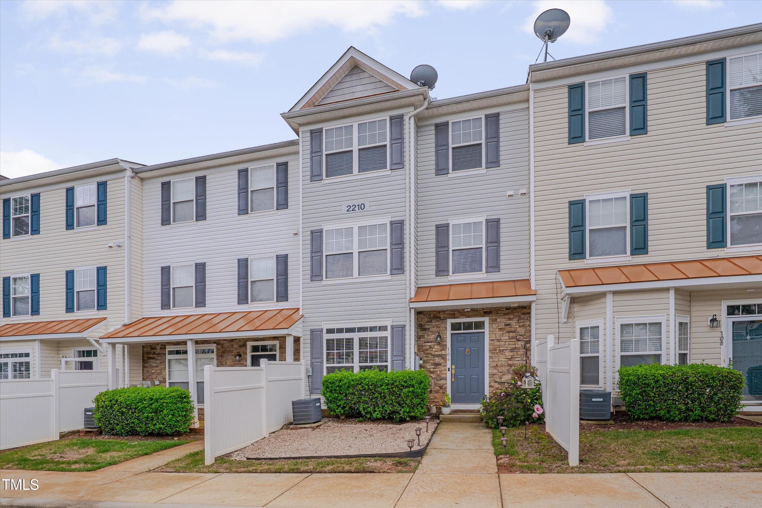 2210 Raven Road, Unit 106 Raleigh, NC 27614 - Photo 1 of 27 a front view of a building with garden