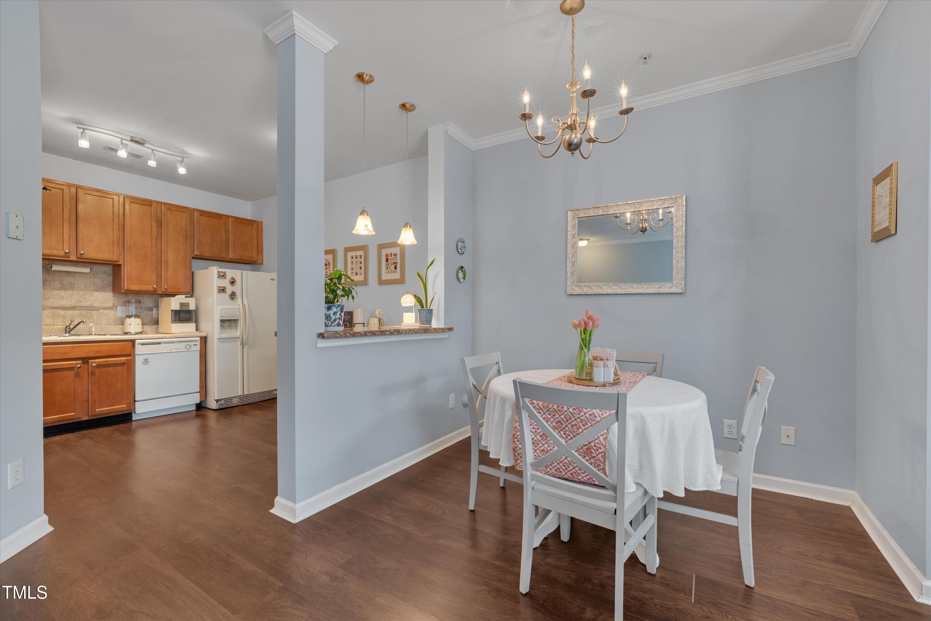 2210 Raven Road, Unit 106 Raleigh, NC 27614 - Photo 10 of 27 a view of a dining room with furniture and wooden floor