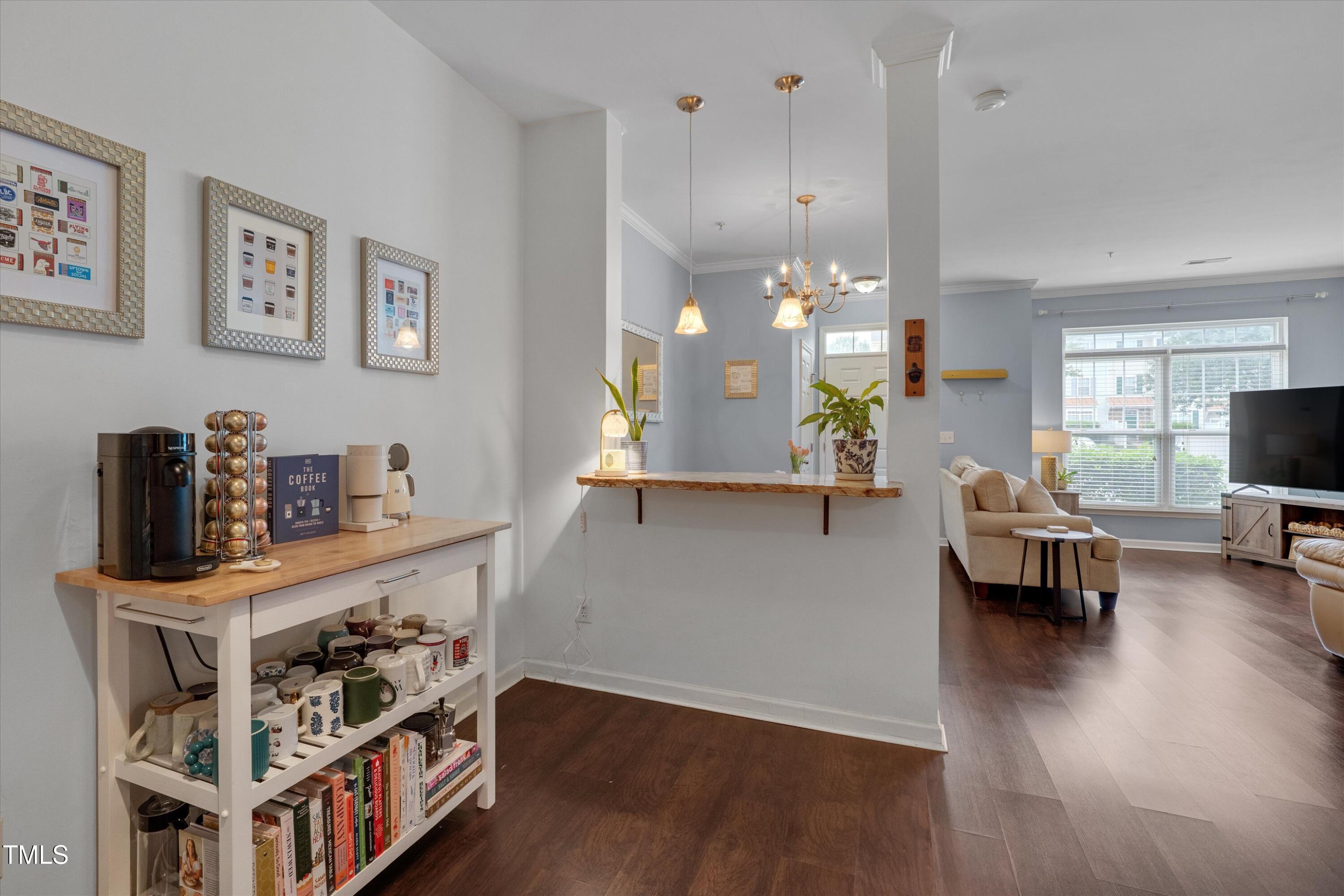 2210 Raven Road, Unit 106 Raleigh, NC 27614 - Photo 13 of 27 a living room with furniture and wooden floor