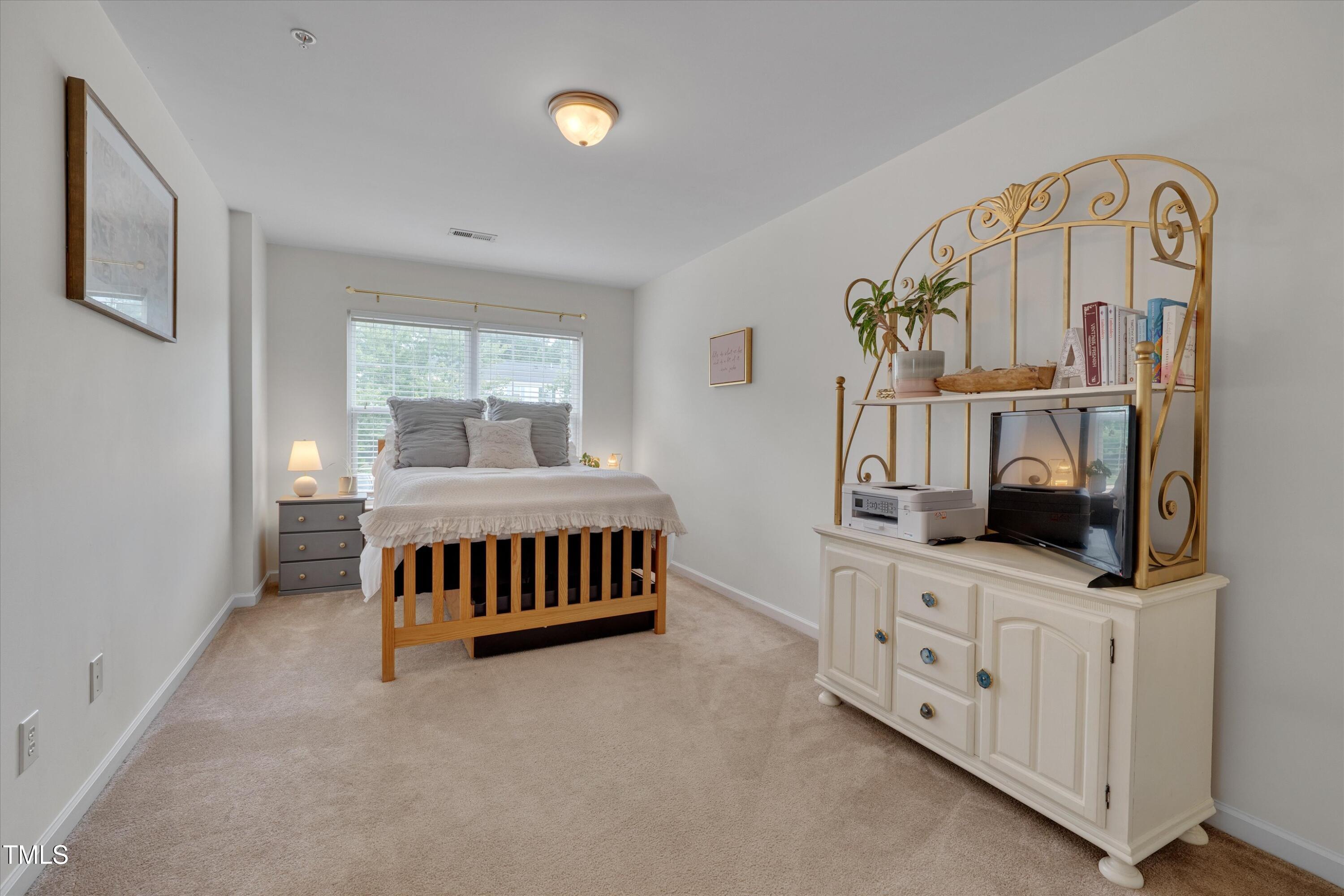2210 Raven Road, Unit 106 Raleigh, NC 27614 - Photo 15 of 27 a living room with furniture and a flat screen tv