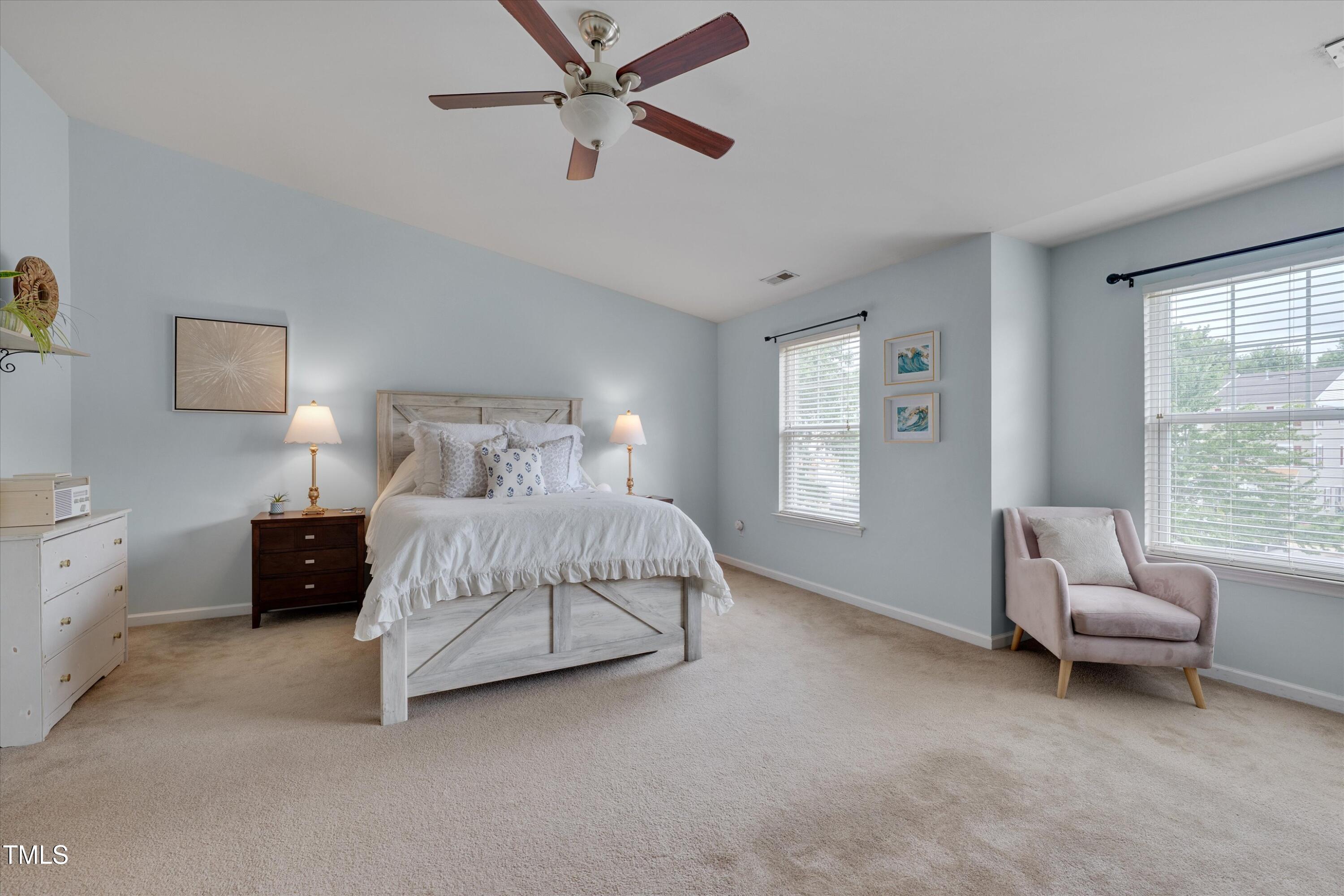 2210 Raven Road, Unit 106 Raleigh, NC 27614 - Photo 21 of 27 a bedroom with a bed a couch and a window