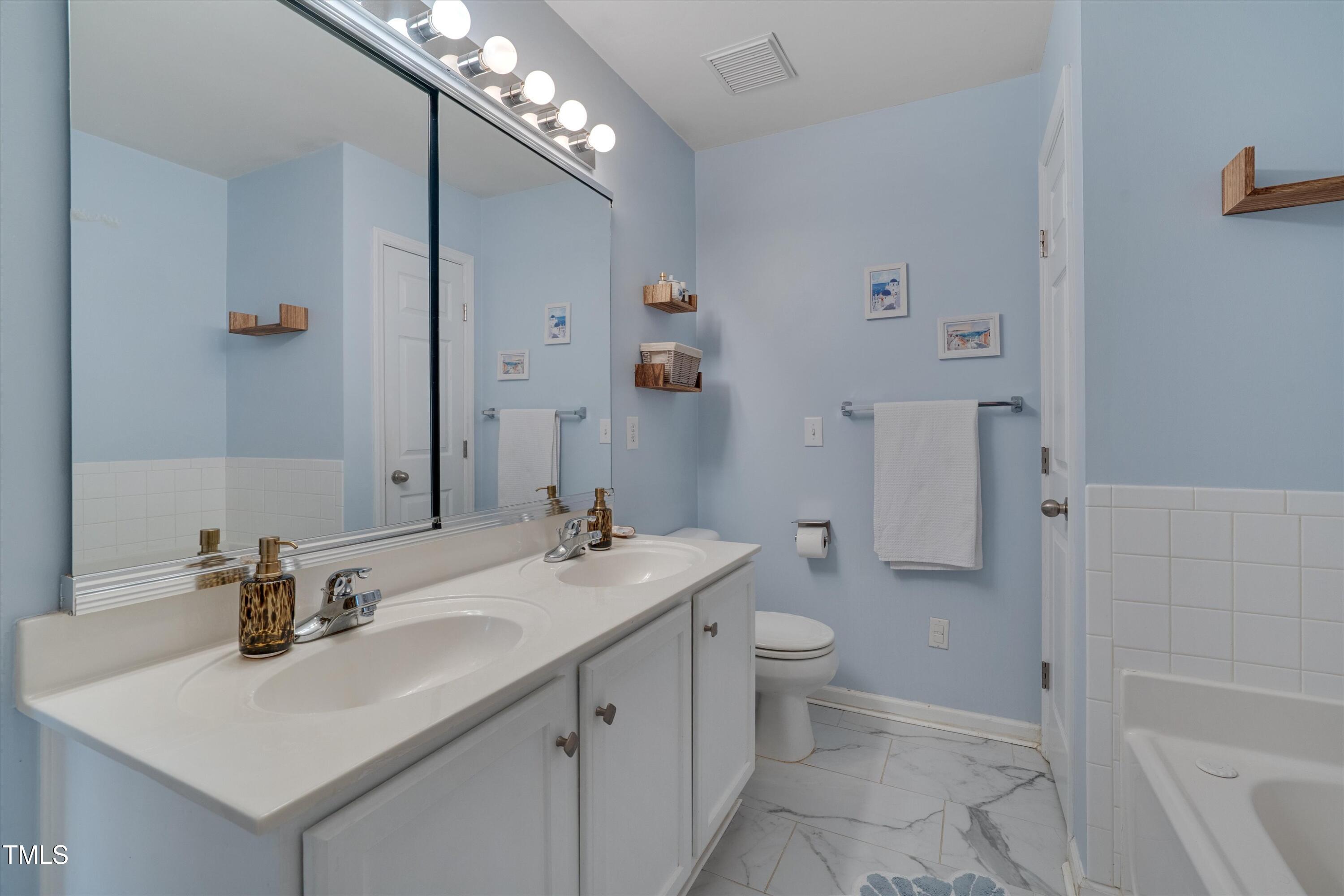 2210 Raven Road, Unit 106 Raleigh, NC 27614 - Photo 26 of 27 a bathroom with a sink toilet and shower