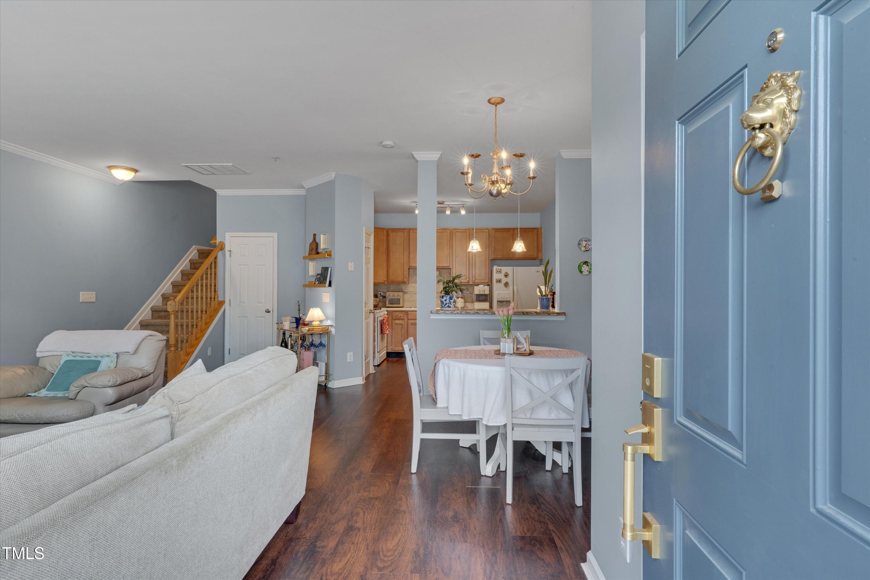 2210 Raven Road, Unit 106 Raleigh, NC 27614 - Photo 3 of 27 a living room with furniture and wooden floor