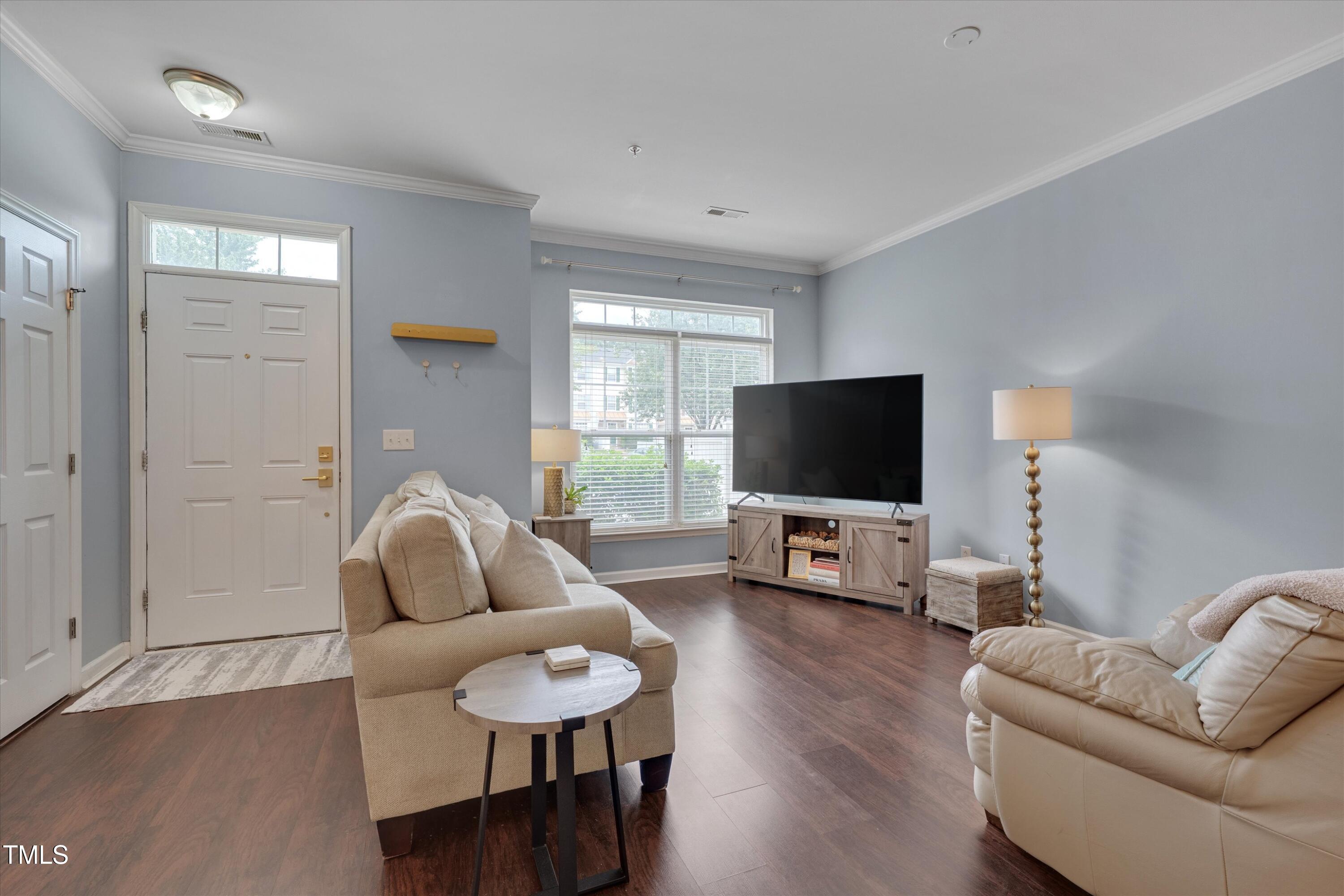2210 Raven Road, Unit 106 Raleigh, NC 27614 - Photo 4 of 27 a living room with furniture and a flat screen tv