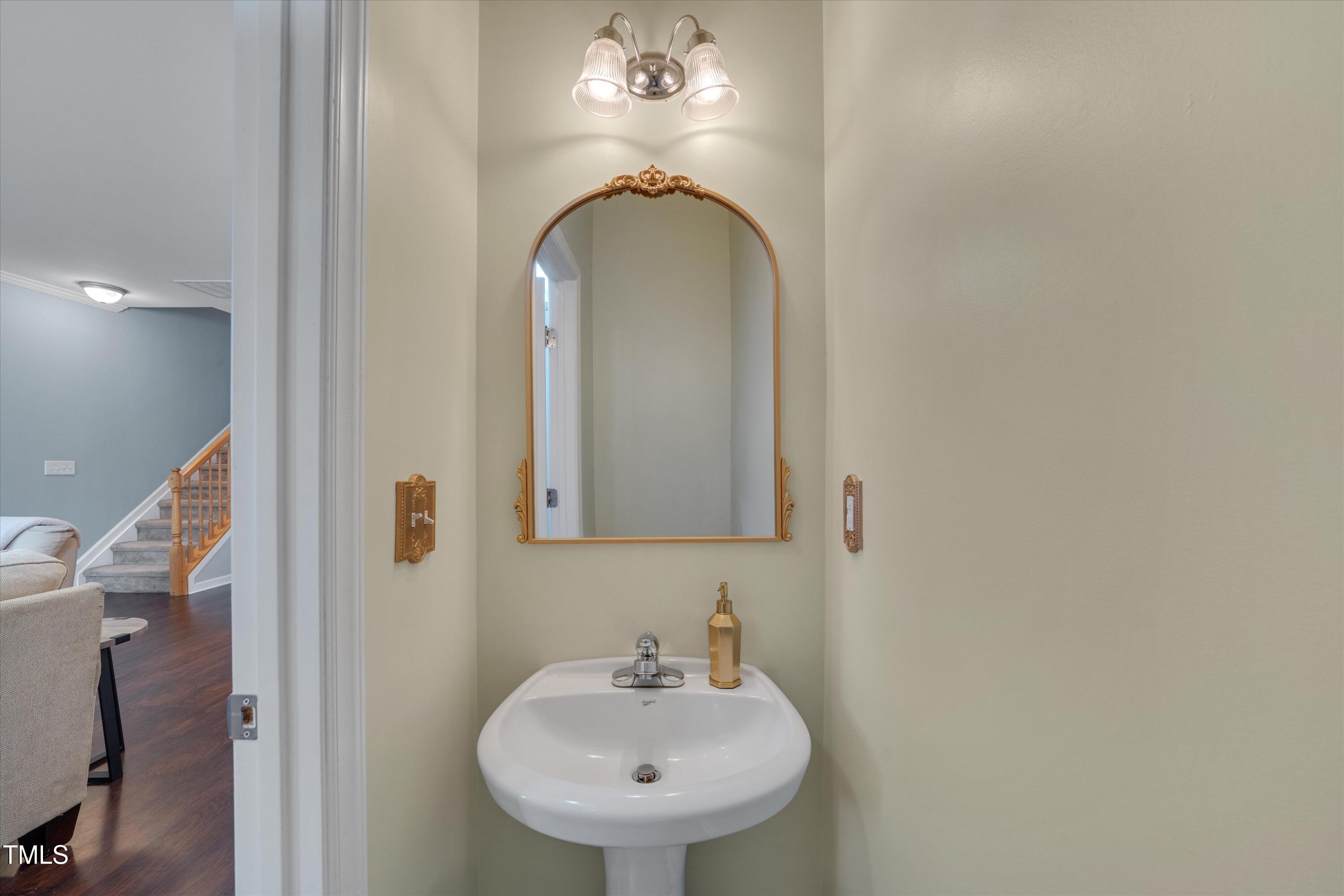 2210 Raven Road, Unit 106 Raleigh, NC 27614 - Photo 5 of 27 a bathroom with a sink and a mirror