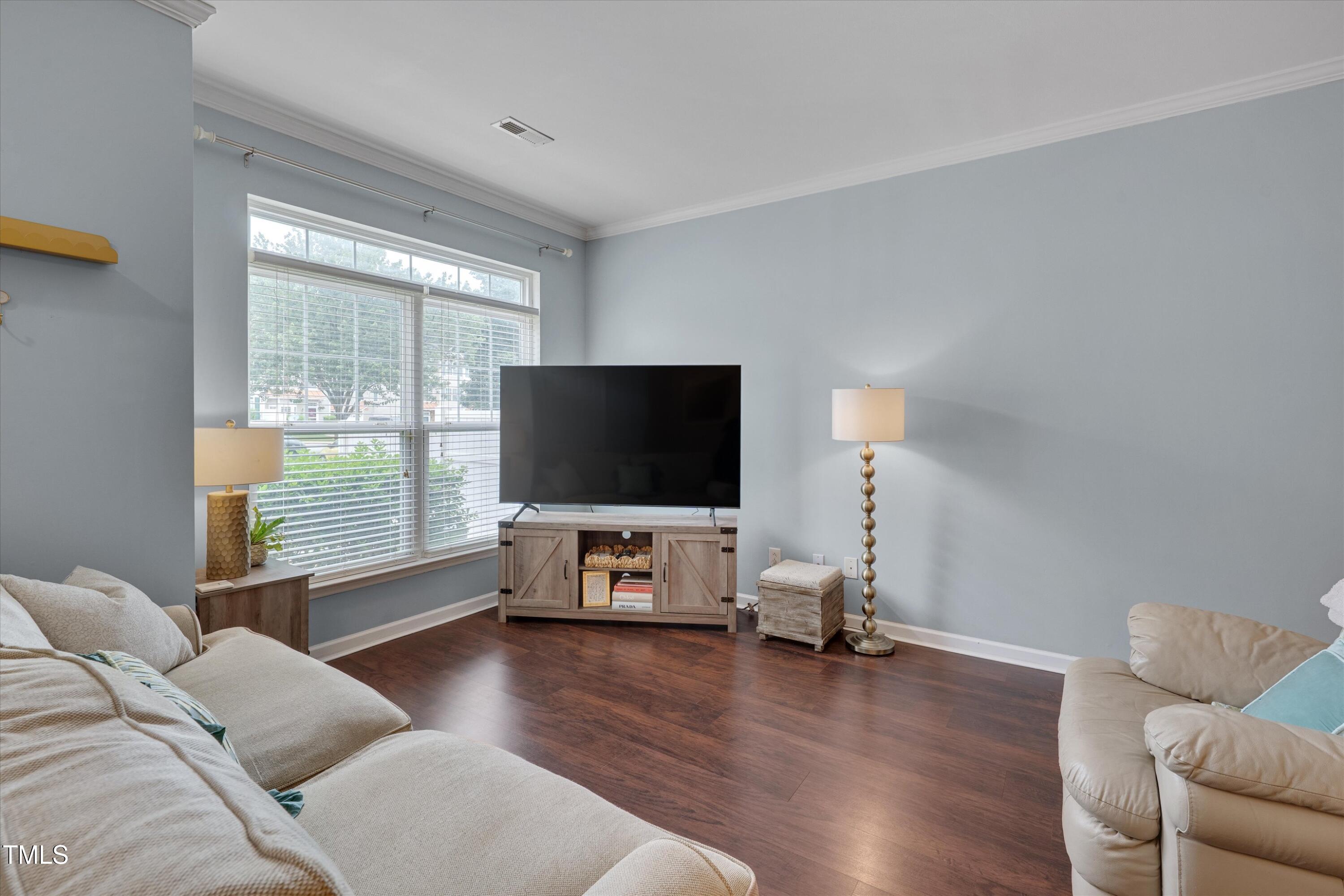 2210 Raven Road, Unit 106 Raleigh, NC 27614 - Photo 6 of 27 a living room with furniture and a flat screen tv