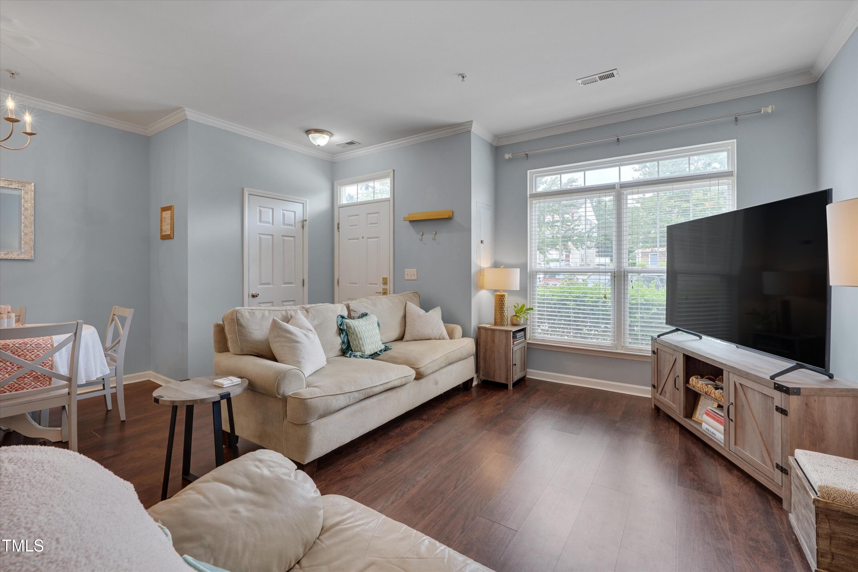 2210 Raven Road, Unit 106 Raleigh, NC 27614 - Photo 7 of 27 a living room with furniture and a flat screen tv
