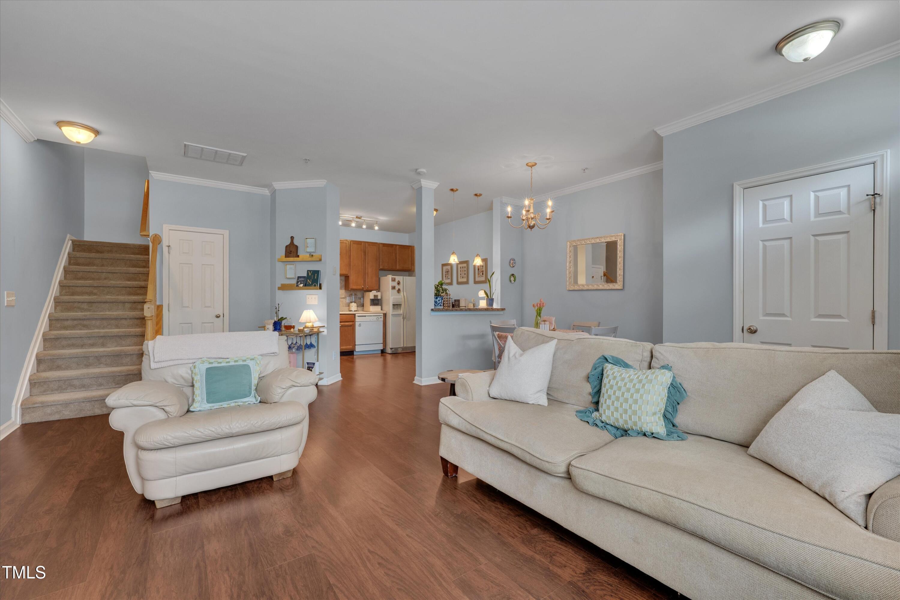 2210 Raven Road, Unit 106 Raleigh, NC 27614 - Photo 8 of 27 a living room with furniture and a wooden floor