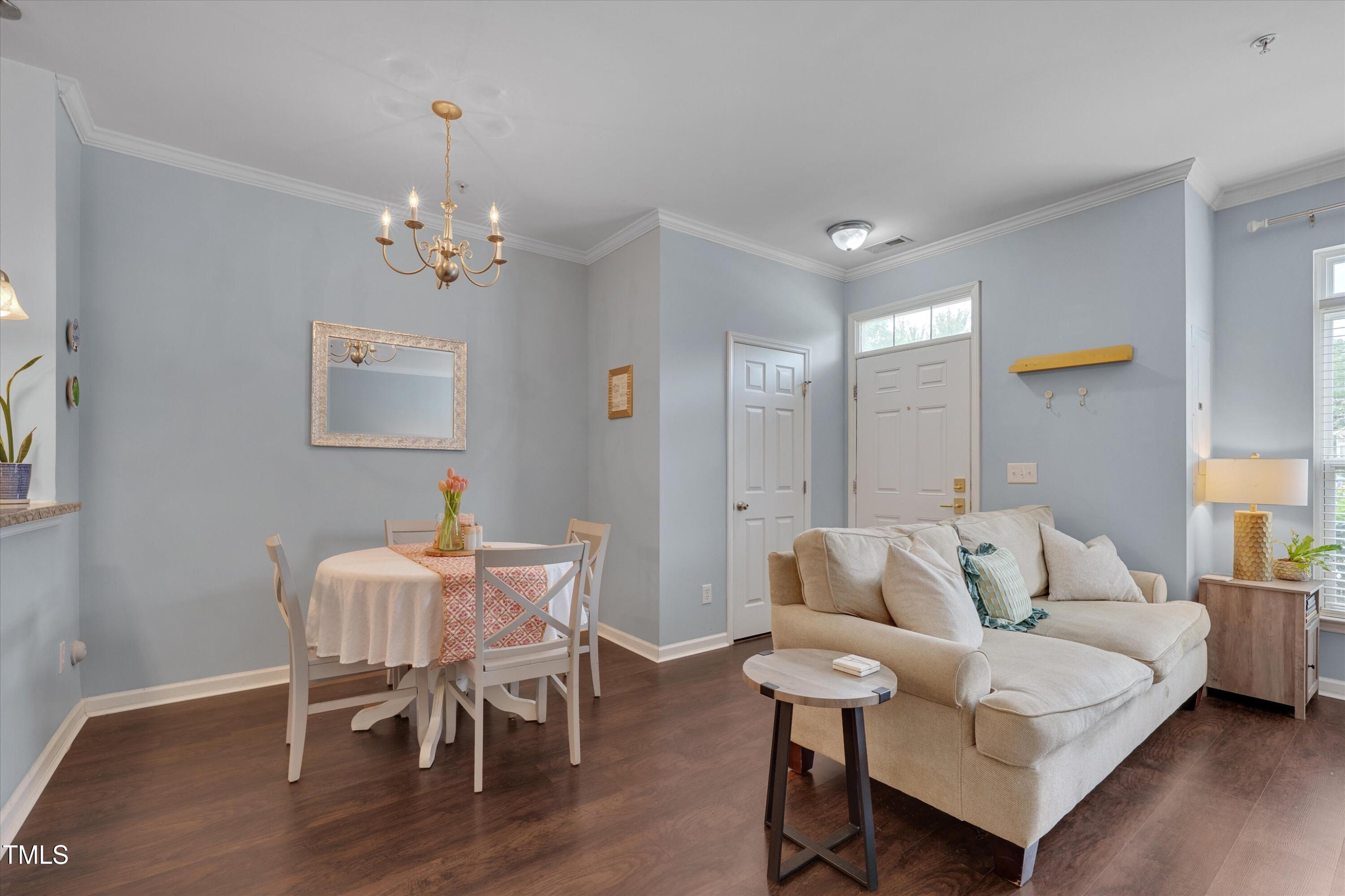 2210 Raven Road, Unit 106 Raleigh, NC 27614 - Photo 9 of 27 a living room with furniture and a wooden floor