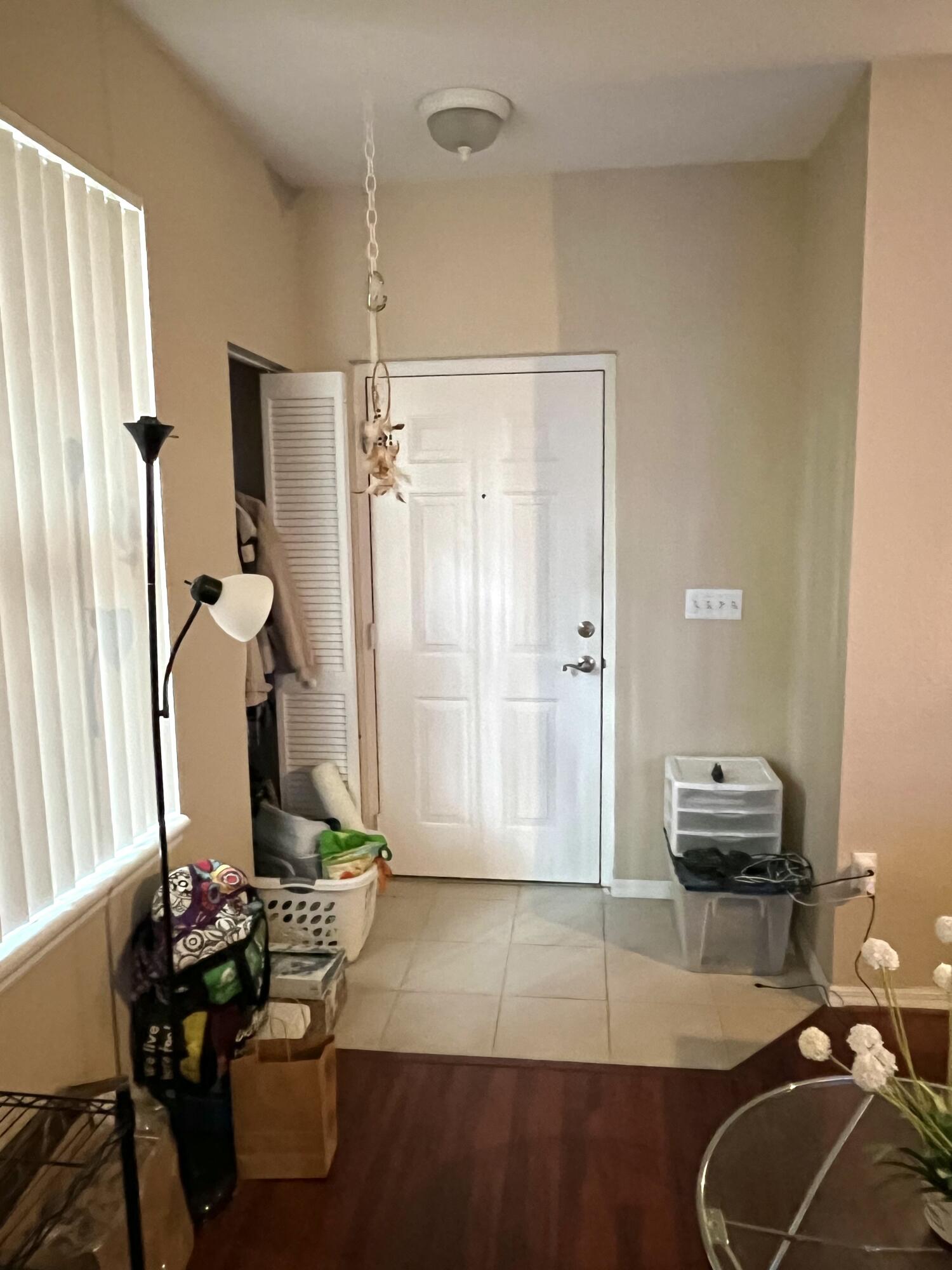 6890 West Sample Road, Unit 6890 Pompano Beach, FL 33063 - Photo 4 of 10 a living room with furniture and a window