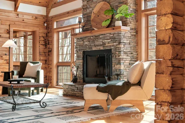 a view of a livingroom with furniture and a fireplace