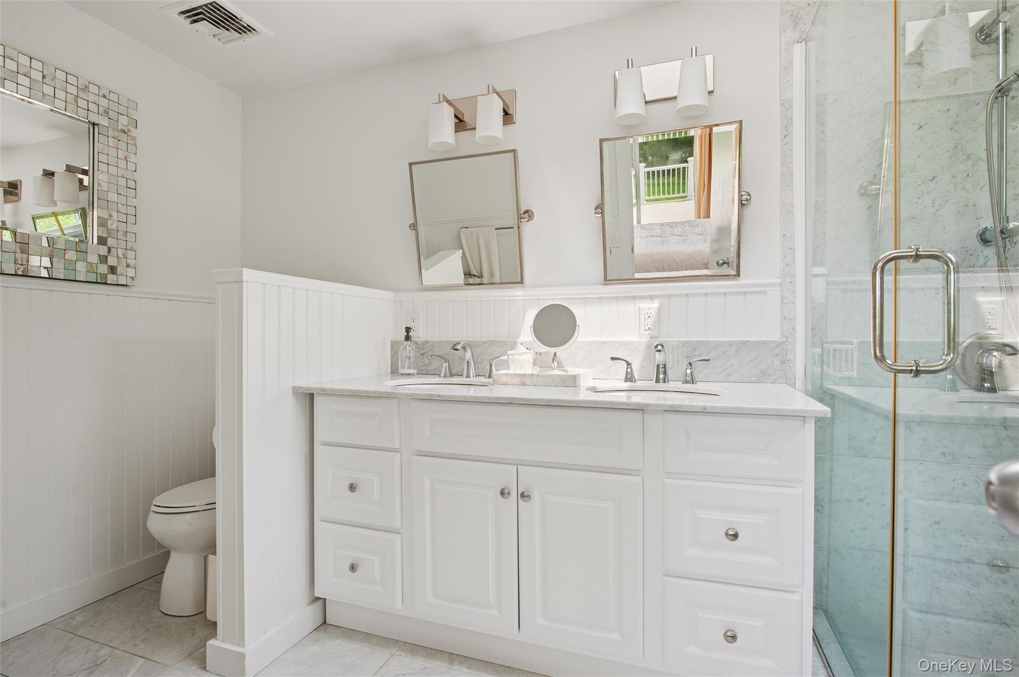 251 Sebonac Road Southampton, NY 11968 - Photo 11 of 15 a bathroom with a granite countertop sink mirror and