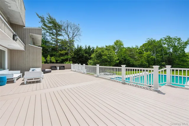 a view of balcony with deck and wooden floor