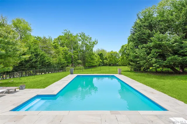 a view of swimming pool with a yard