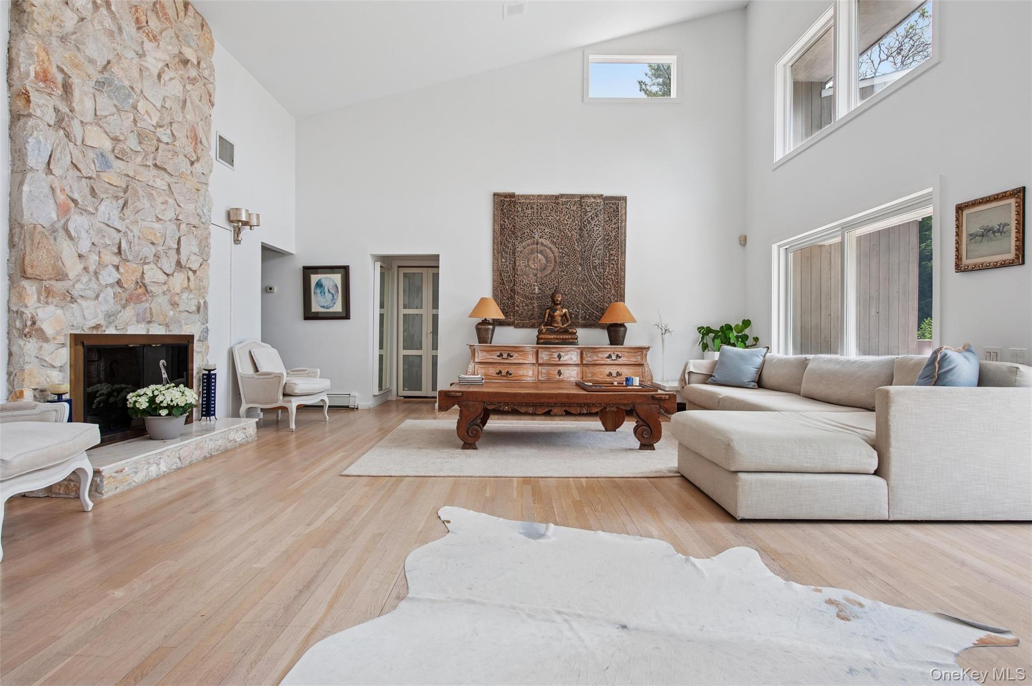 251 Sebonac Road Southampton, NY 11968 - Photo 2 of 15 a living room with furniture and a fireplace