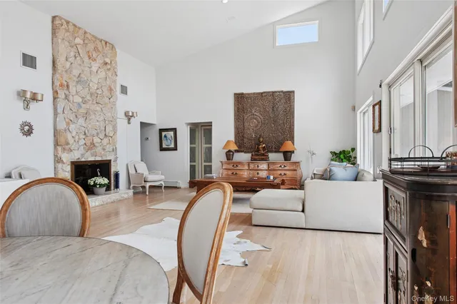 a living room with furniture and fireplace