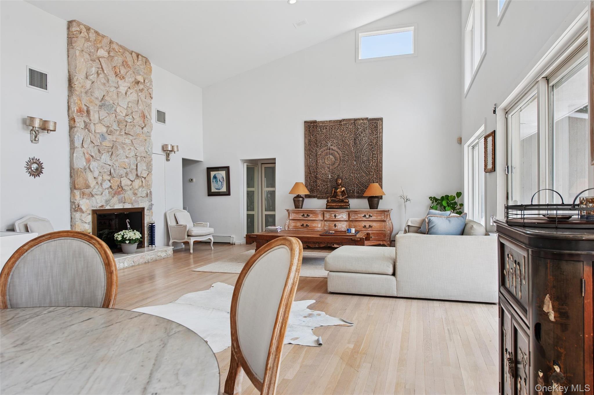 251 Sebonac Road Southampton, NY 11968 - Photo 4 of 15 a living room with furniture and fireplace