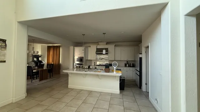 a living room with kitchen island furniture and a view of living room