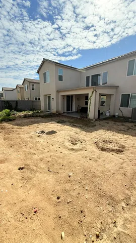 a view of a house with a wooden roof and a window