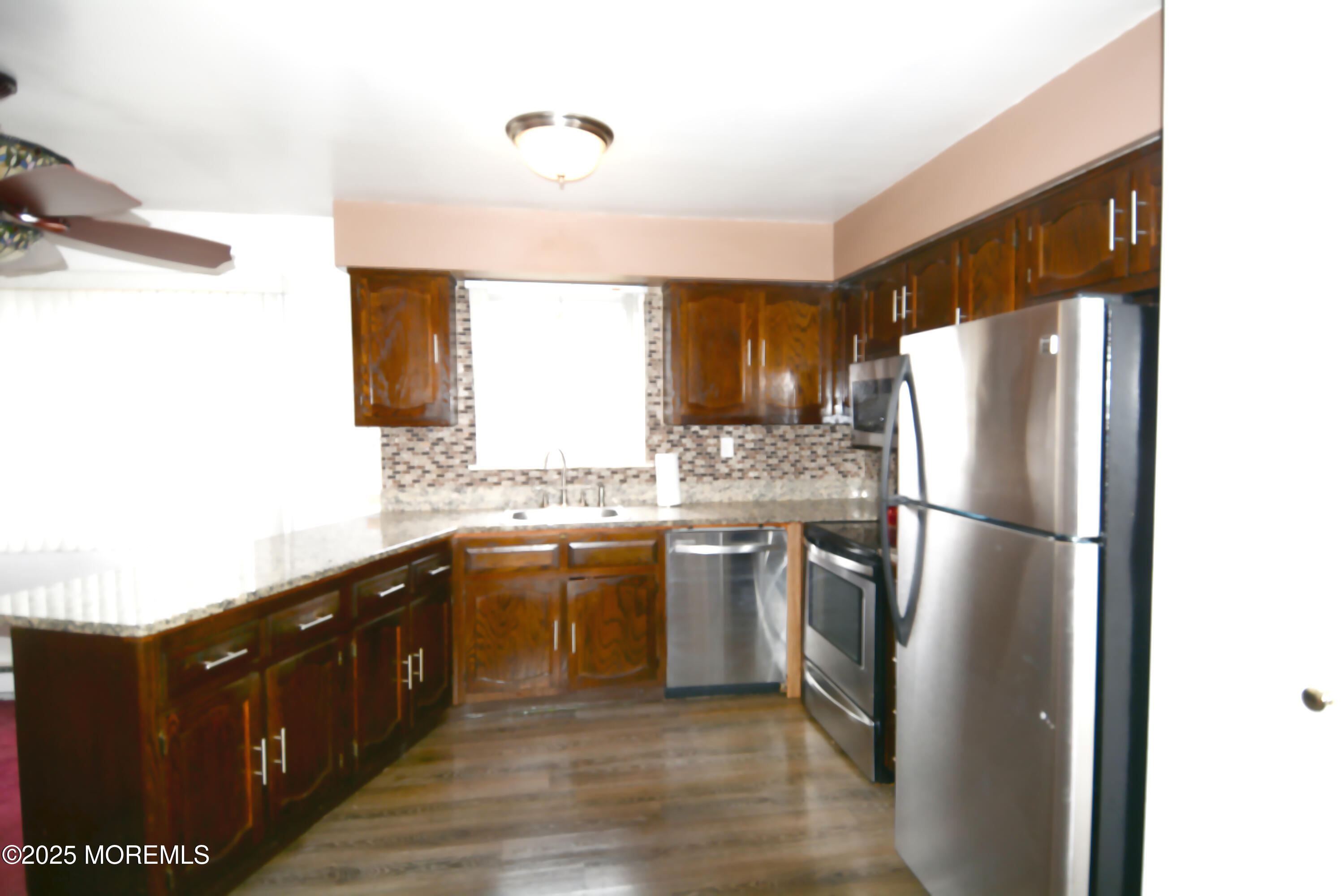 15 Markham Road Brick, NJ 08724 - Photo 4 of 28 a kitchen with a refrigerator a sink and dishwasher
