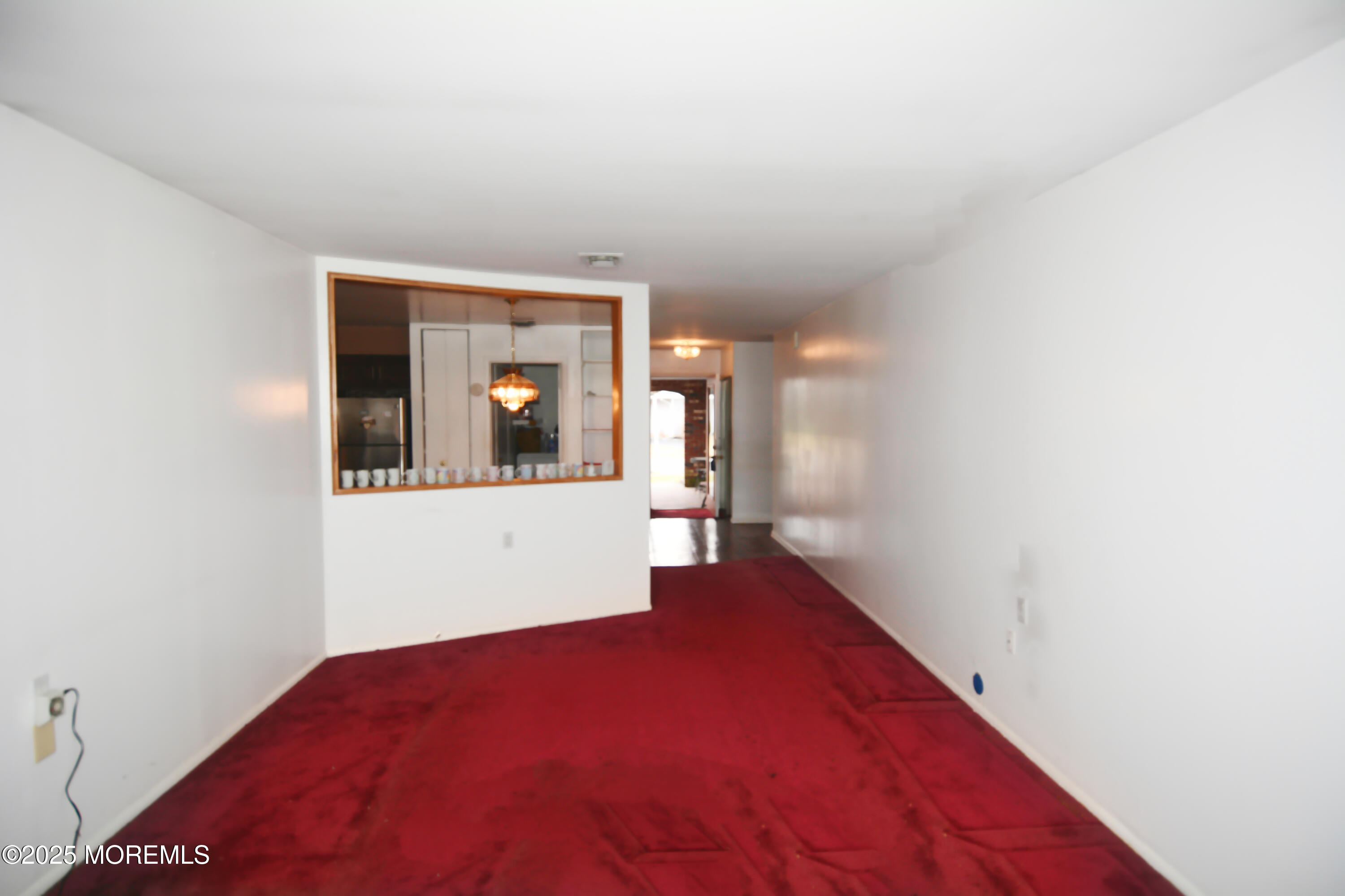 15 Markham Road Brick, NJ 08724 - Photo 6 of 28 a view of a big room with wooden floor and a large window