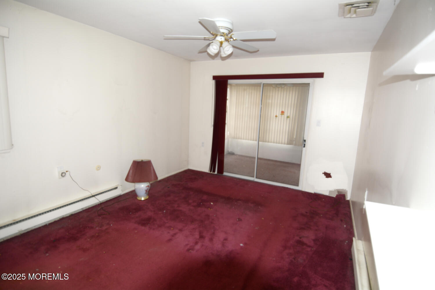 15 Markham Road Brick, NJ 08724 - Photo 9 of 28 a living room with a bed and a chandelier