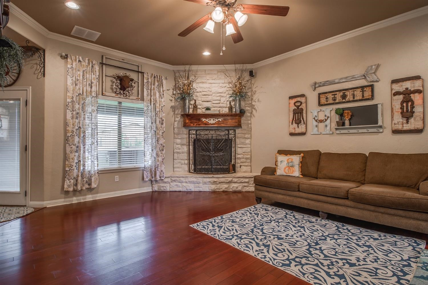 5518 104th Street Lubbock, TX 79424 - Photo 7 of 10 a living room with furniture and a fireplace
