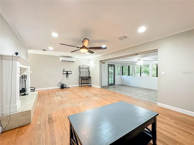 a bathroom with a sink a toilet a mirror a vanity and shower
