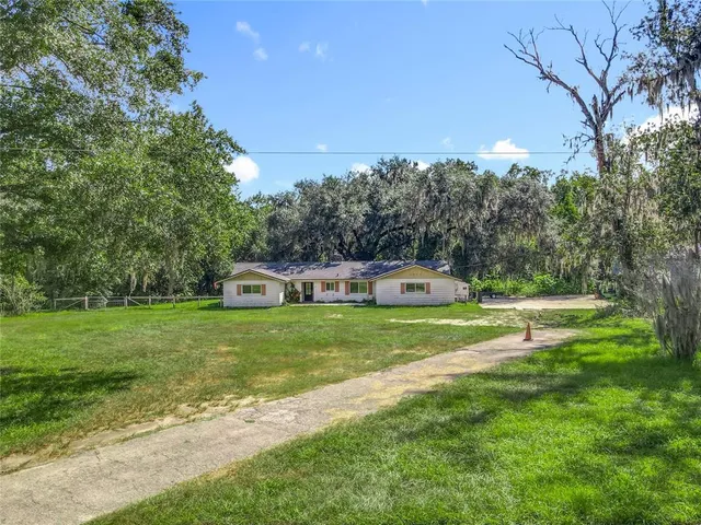 a front view of a house with yard