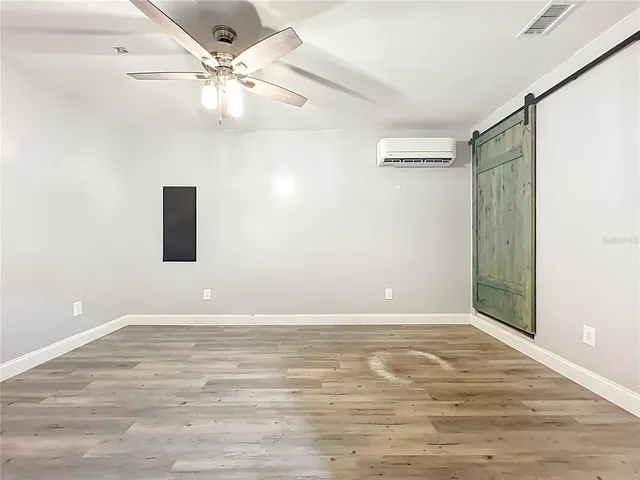 a view of a house with sitting area and garden
