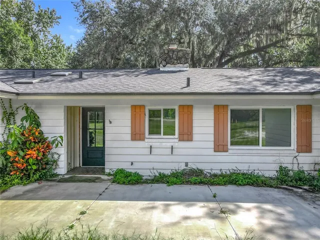 a large kitchen with stainless steel appliances granite countertop a stove and a sink