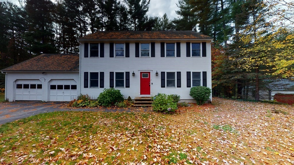 7 Nehemiah Road Shirley, MA 01464 - Photo 1 of 37 a front view of a house with a yard