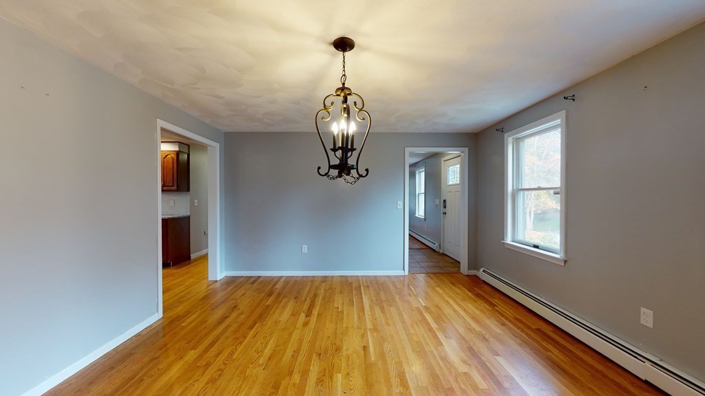 7 Nehemiah Road Shirley, MA 01464 - Photo 12 of 37 a view of empty room with wooden floor and fan