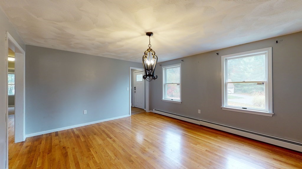 7 Nehemiah Road Shirley, MA 01464 - Photo 13 of 37 a view of empty room with wooden floor and fan
