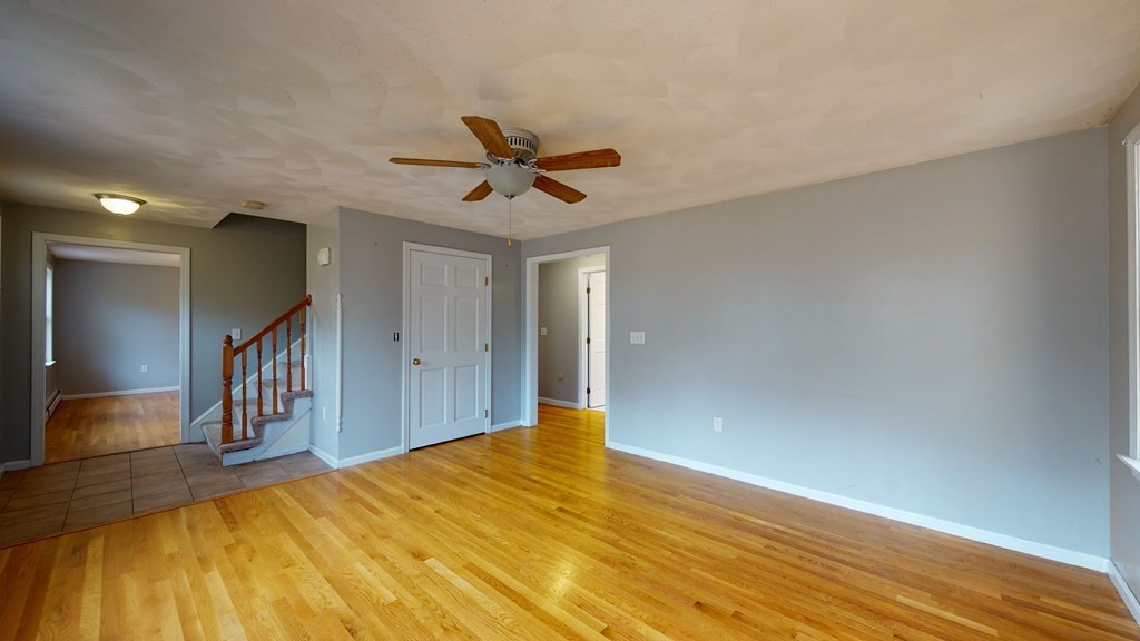 7 Nehemiah Road Shirley, MA 01464 - Photo 14 of 37 a view of a livingroom with wooden floor and a ceiling fan