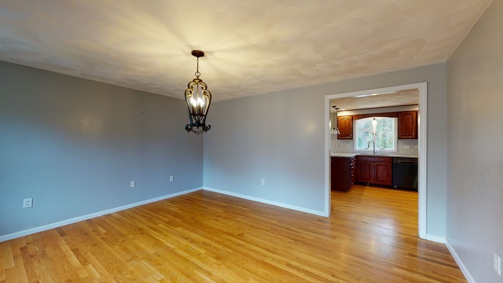 7 Nehemiah Road Shirley, MA 01464 - Photo 15 of 37 a view of empty room with wooden floor and fan