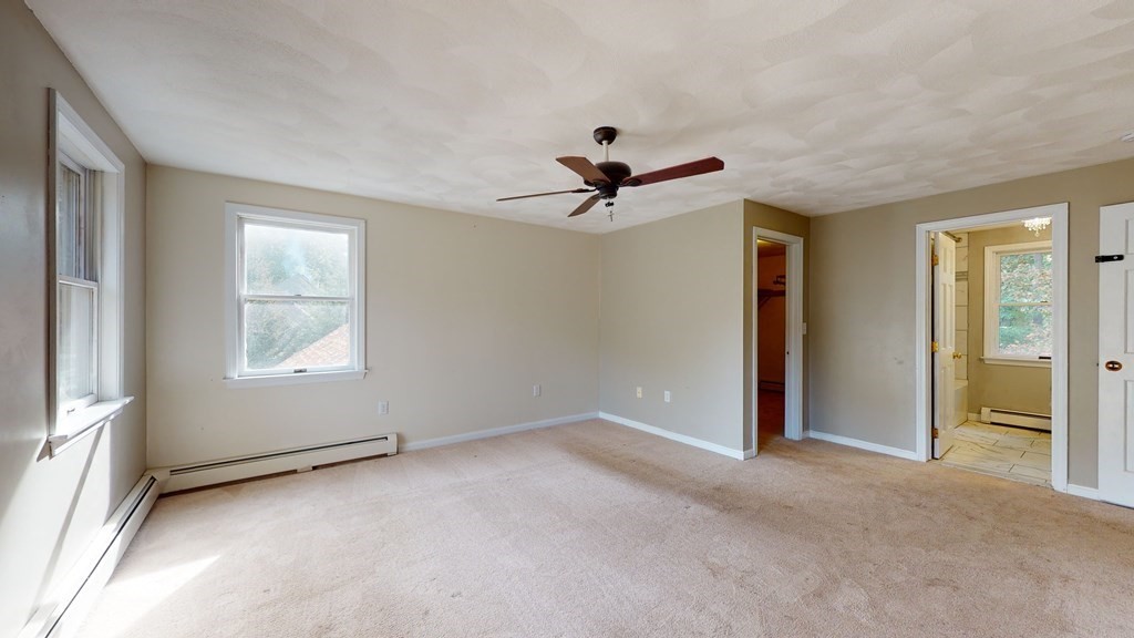 7 Nehemiah Road Shirley, MA 01464 - Photo 18 of 37 an empty room with closet and windows