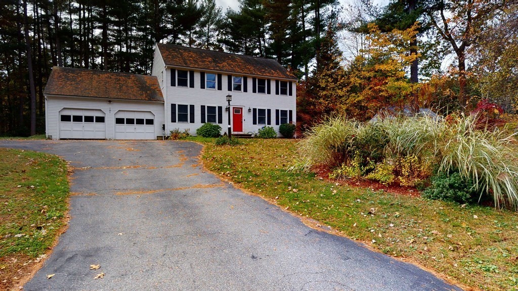 7 Nehemiah Road Shirley, MA 01464 - Photo 2 of 37 a front view of house with yard and trees around