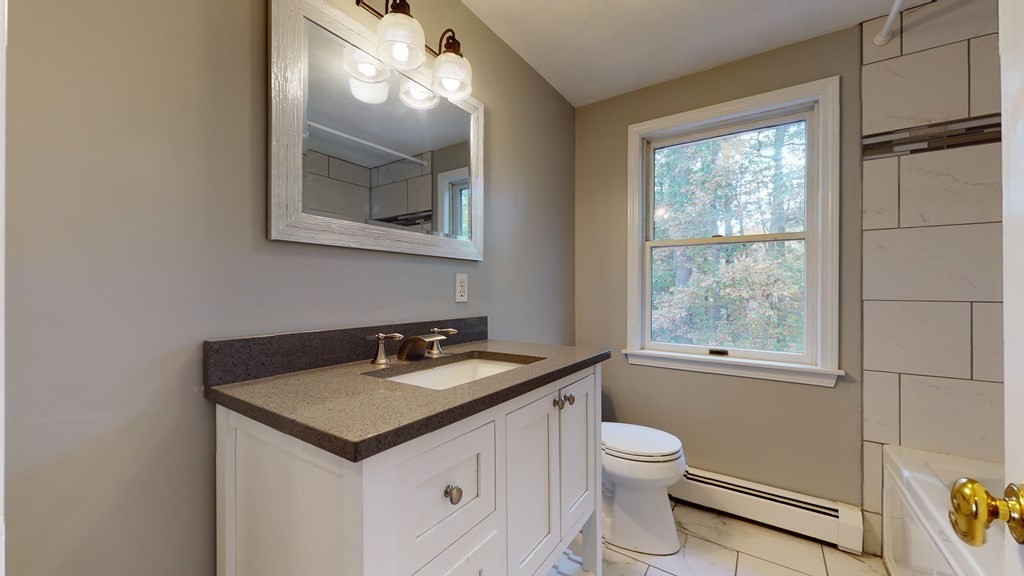 7 Nehemiah Road Shirley, MA 01464 - Photo 27 of 37 a bathroom with a toilet sink and mirror