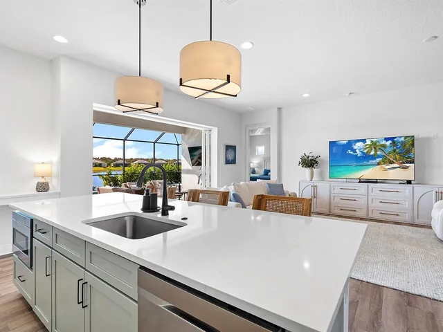 a spacious bathroom with a double vanity sink a large mirror a shower and a bathtub