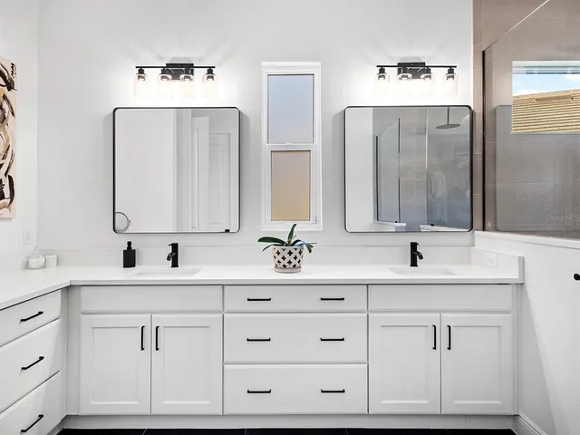 a living room with furniture and white walls