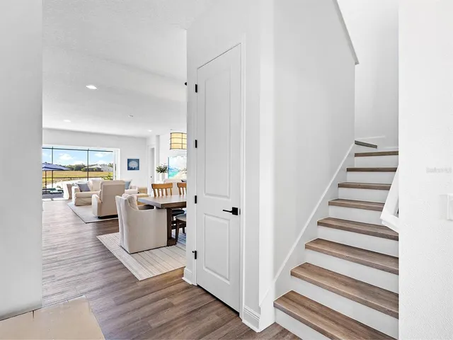 a view of swimming pool with outdoor seating and yard