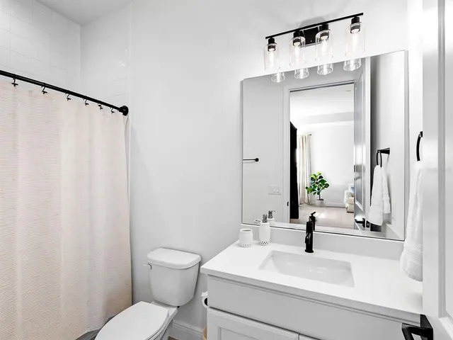 a view of a big house with a big yard