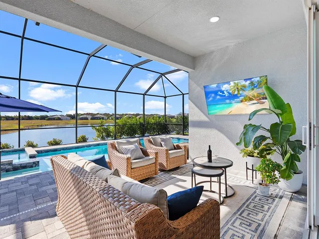 an aerial view of a golf course with a swimming pool