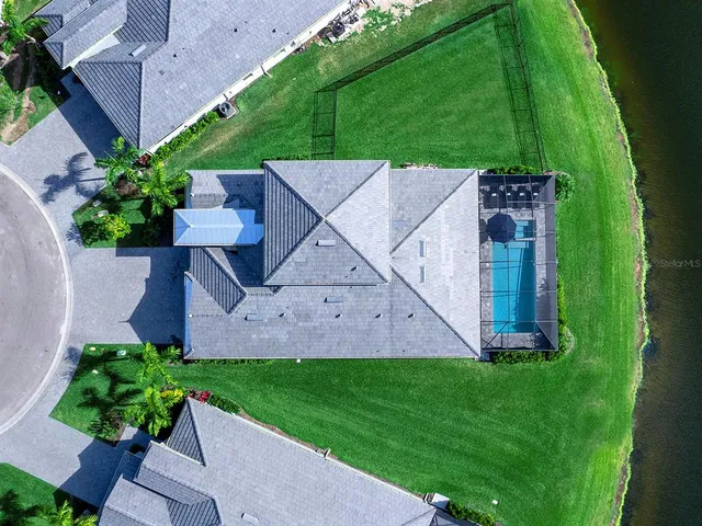 a view of a swimming pool with outdoor seating